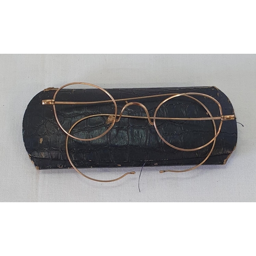 204 - Antique cased pair of gold rimmed wire frame glasses tests as 18k, total weight 5.5grams