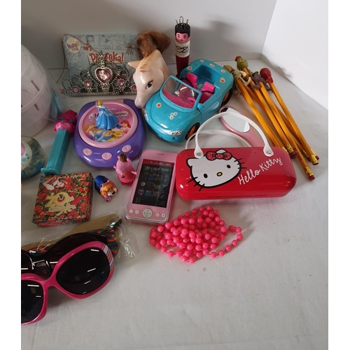 286 - Group of children's toys including a Frozen game, hello Kitty glasses case and Disney items