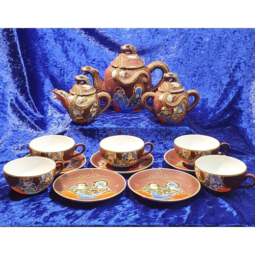 162 - An ornately decorated Oriental Tea set consisting of 5 Cups & Saucers, Teapot, Lidded jar and sm... 