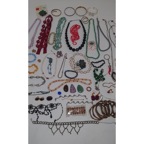 209 - Large collection of various costume jewellery including bangles, beaded necklaces, bracelets etc