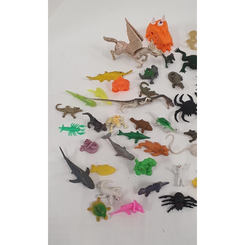 304 - Good group of plastic and rubber small toys in the forms of dinosaurs, aliens, mythical creatures, s... 