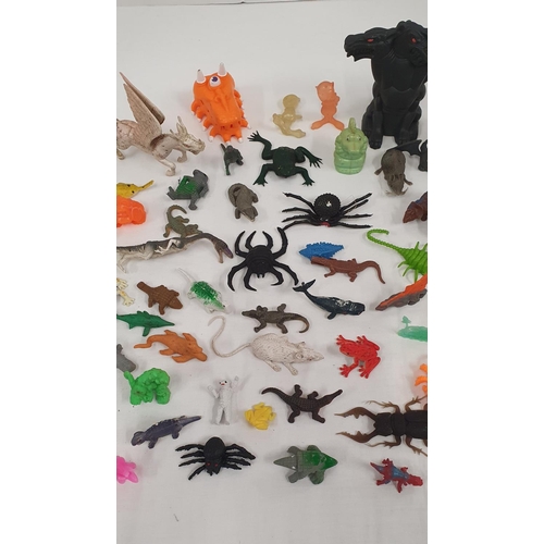 304 - Good group of plastic and rubber small toys in the forms of dinosaurs, aliens, mythical creatures, s... 