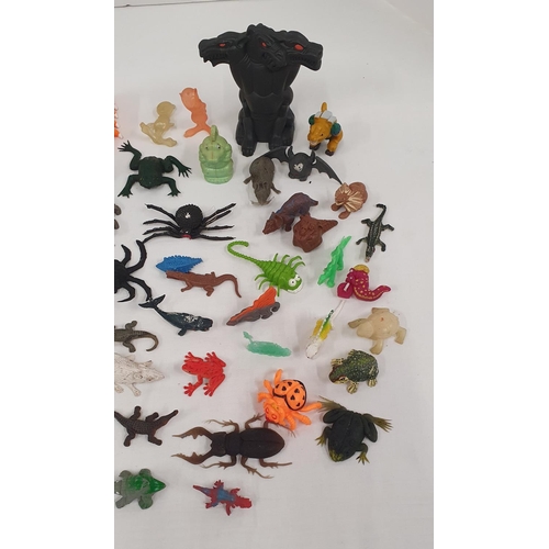 304 - Good group of plastic and rubber small toys in the forms of dinosaurs, aliens, mythical creatures, s... 