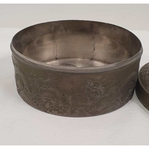 58 - Impressive heavy pewter tin with oriental dragon design to the lid