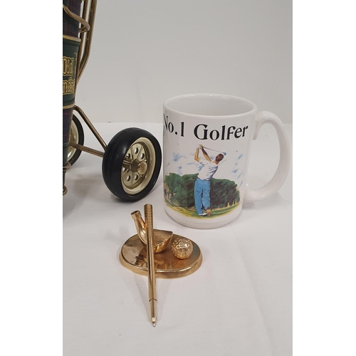 411 - Small group of golfing paraphernalia including a brass pen stand, mug and a St Andrews whisky bottle... 