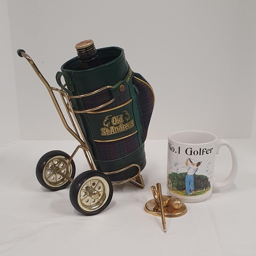 411 - Small group of golfing paraphernalia including a brass pen stand, mug and a St Andrews whisky bottle... 