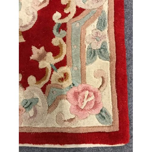 96 - Small deep pile wool rug with symmetrical floral design, 24