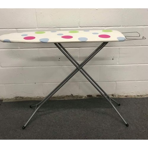 34 - Metal framed ironing board with colourful circle design