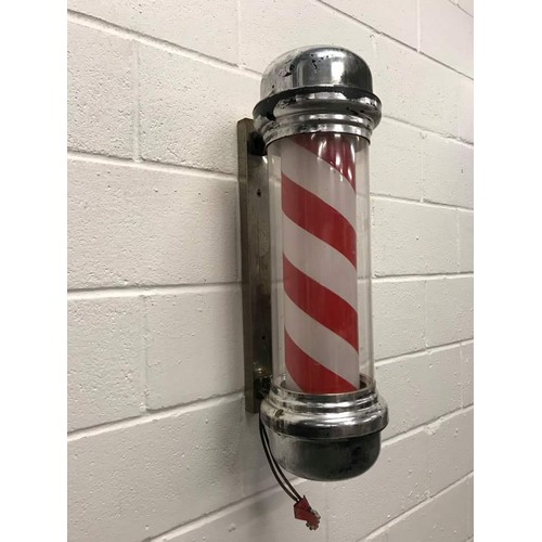 129 - Novelty plastic wall mount light in the form of a barbers shop sign