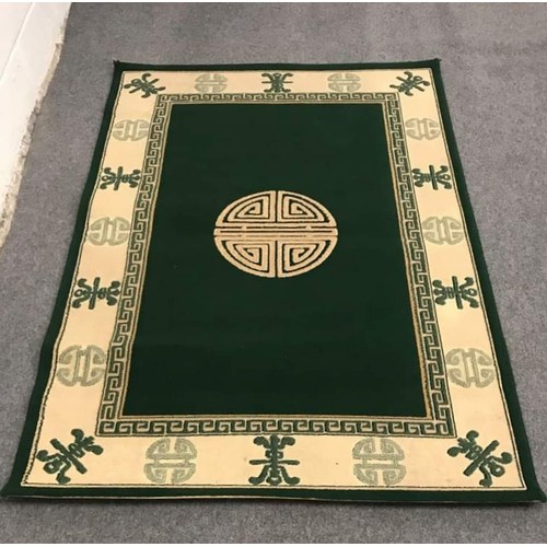 112 - Good quality oriental ground rug with green and beige colouring (B) 47.5