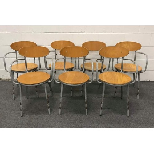 575 - 7 metal framed stacking steam wood carver chairs