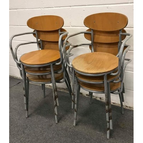 575 - 7 metal framed stacking steam wood carver chairs