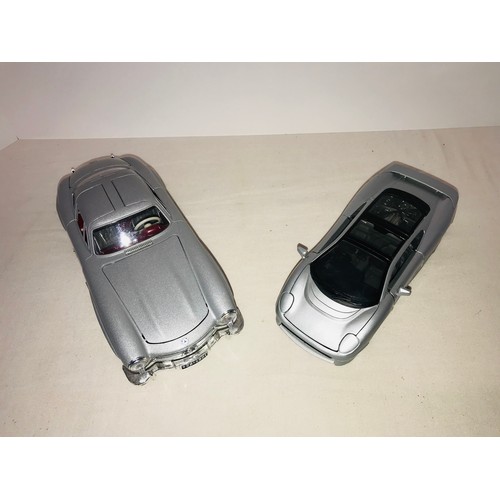 284 - 2 Diecast scale model cars by Burago & Maisto 300SL and Jaguar XJ220