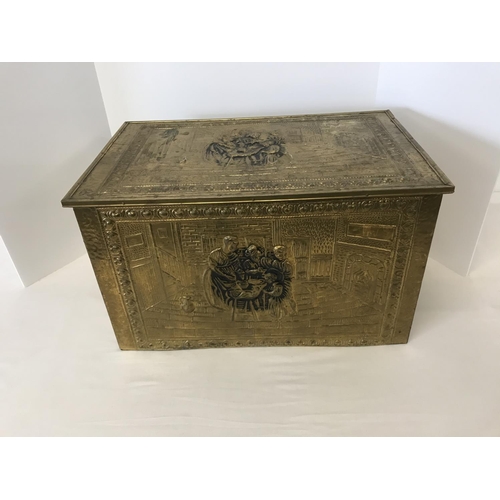 48 - Large brass embossed log box depicting family scene, 22