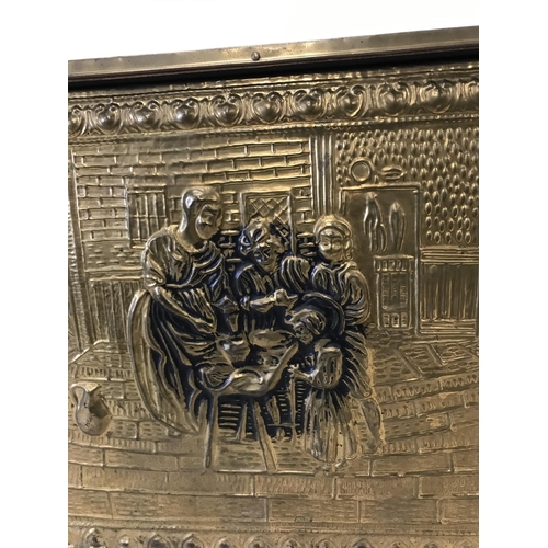 48 - Large brass embossed log box depicting family scene, 22