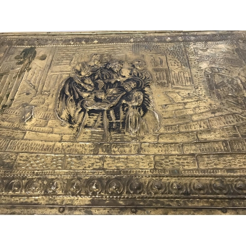 48 - Large brass embossed log box depicting family scene, 22