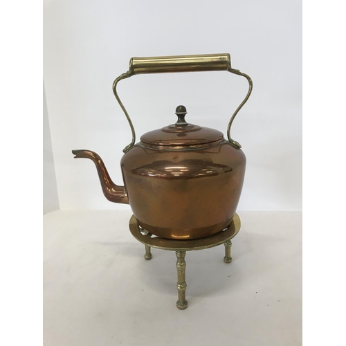 50 - Copper kettle on brass trivet