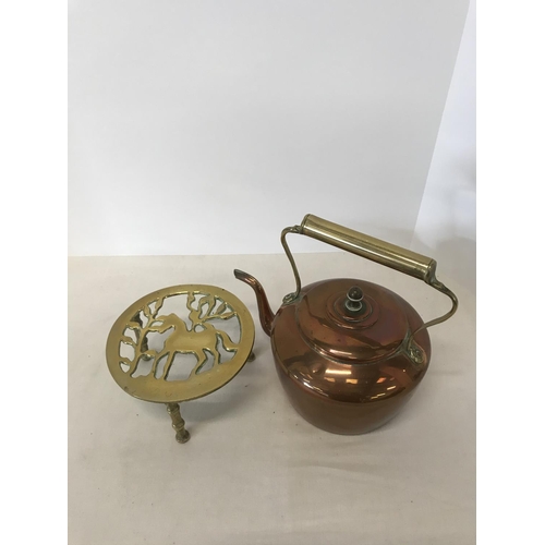 50 - Copper kettle on brass trivet