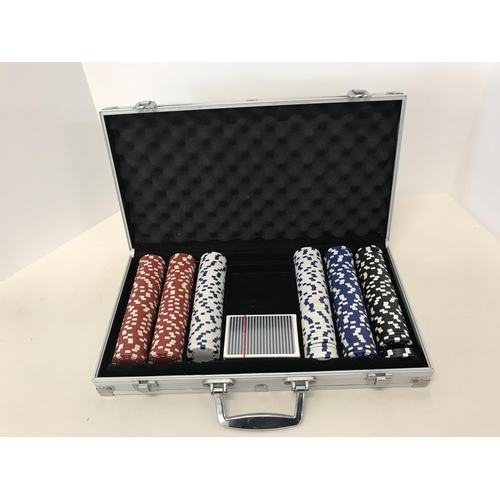 290 - Metal cased poker chip set with pack of sealed playing cards