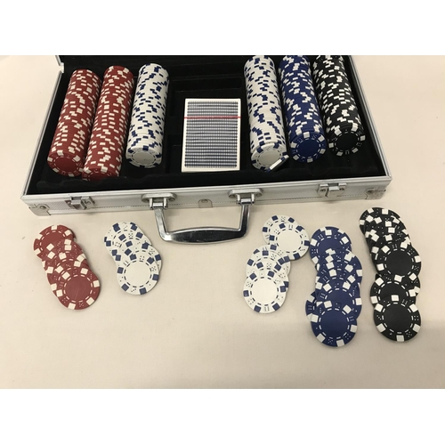 290 - Metal cased poker chip set with pack of sealed playing cards