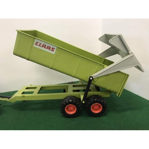 291 - Large green toy models in 2 different scales, A Tractor and a Trailer with moving parts