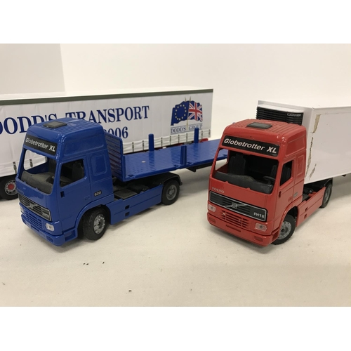 292 - Collection of large scale Volvo trucks with 4 trailers one depicting Dodd's Transport livery