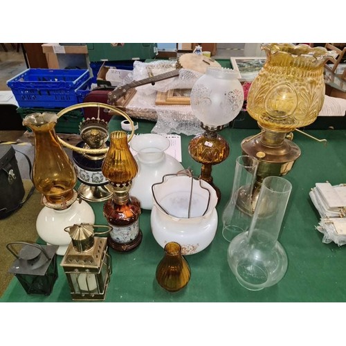 83 - Collection of mixed oil lamp bases and globes