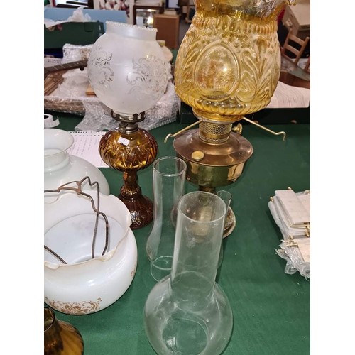 83 - Collection of mixed oil lamp bases and globes