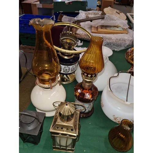 83 - Collection of mixed oil lamp bases and globes