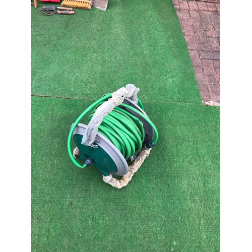 121 - Green hosepipe on reel