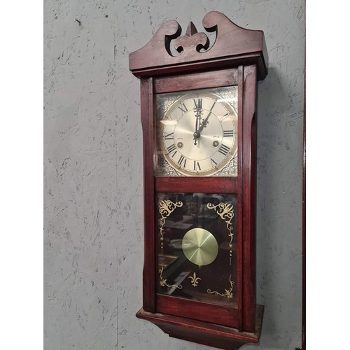 106 - Mahogany finish wind up wall clock