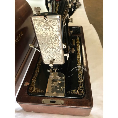 24 - wooden cased singer decorative table top sewing machine model number y8482707 with black and floral ... 