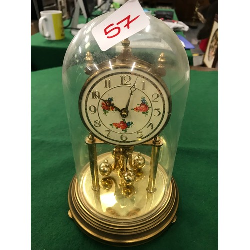 57 - Vintage German brass anniversary clock under glass dome, cream coloured dial with Arabic numerals an... 