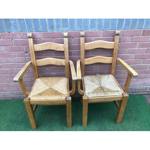 104 - Pair of beech framed Bretton  rustic style rush seated carver arm chairs (see all photos)