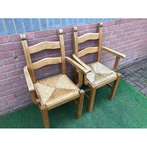 104 - Pair of beech framed Bretton  rustic style rush seated carver arm chairs (see all photos)