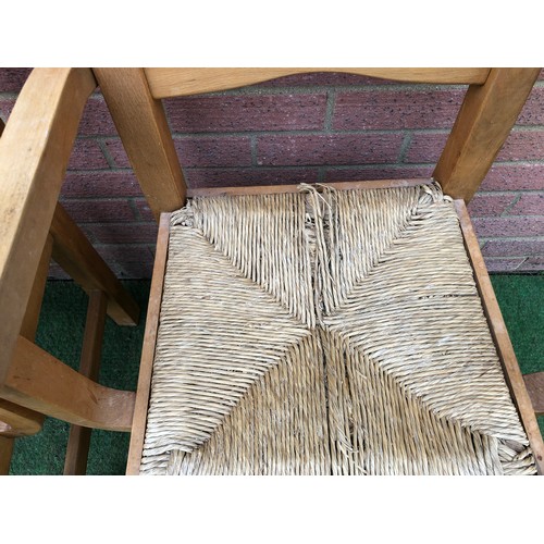 104 - Pair of beech framed Bretton  rustic style rush seated carver arm chairs (see all photos)