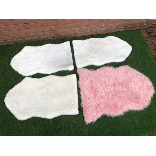 107 - Four fluffy floor mats in sheep skin effect