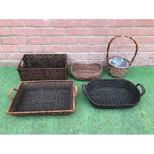 116 - Quantity of five dark colour display baskets