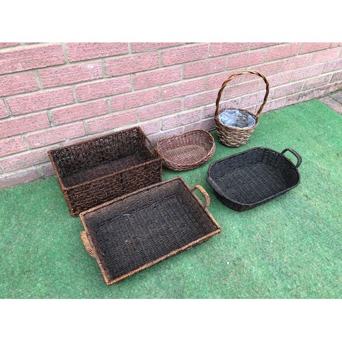 116 - Quantity of five dark colour display baskets
