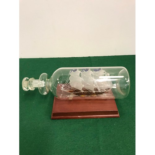 26 - Glass Ship in a Bottle on stand [ mast is loose ]
