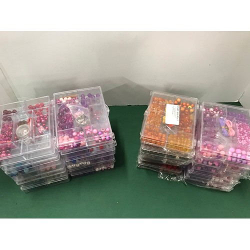 39 - 10 sealed boxes of craft beads 12 unsealed boxes of craft beads