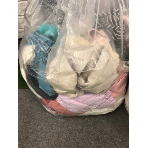 133 - Four bags of mixed used clothing up to size 28