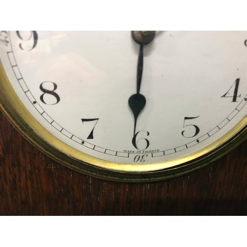 159 - French Oak Cased arch top mantle clock With Barley twist columns and wind up movement