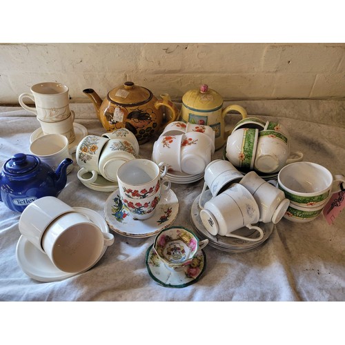 Mixed tea pot , cups and saucers