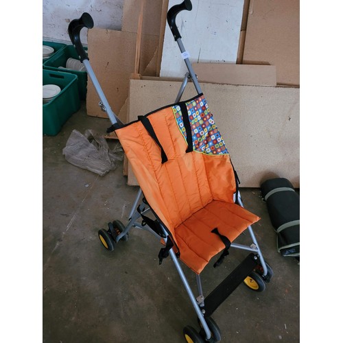 24 - hauck pushchair and a Childs plastic cooker top