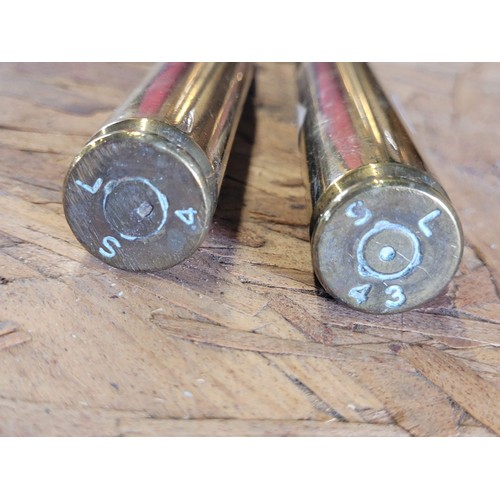 119 - 2 x Brass rounds 1943 dated