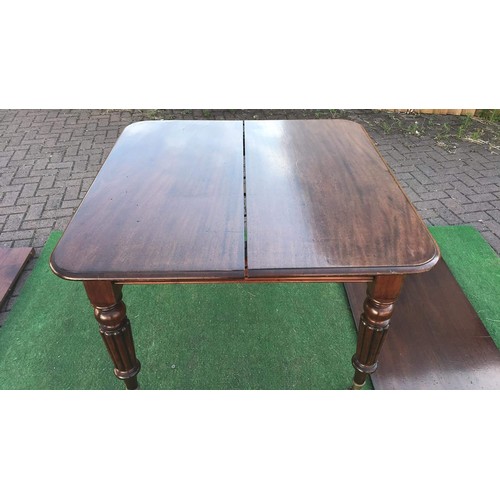 111 - Victorian mahogany wind out extending dining table with leaf