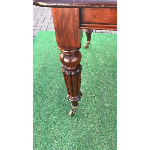 111 - Victorian mahogany wind out extending dining table with leaf