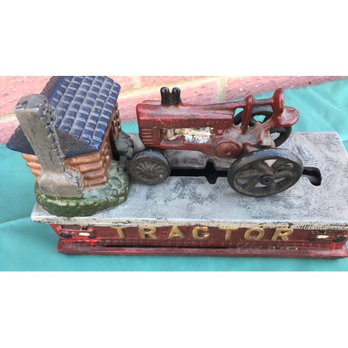 34 - Tractor money box in cast metal