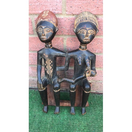 45 - Tribal carved family